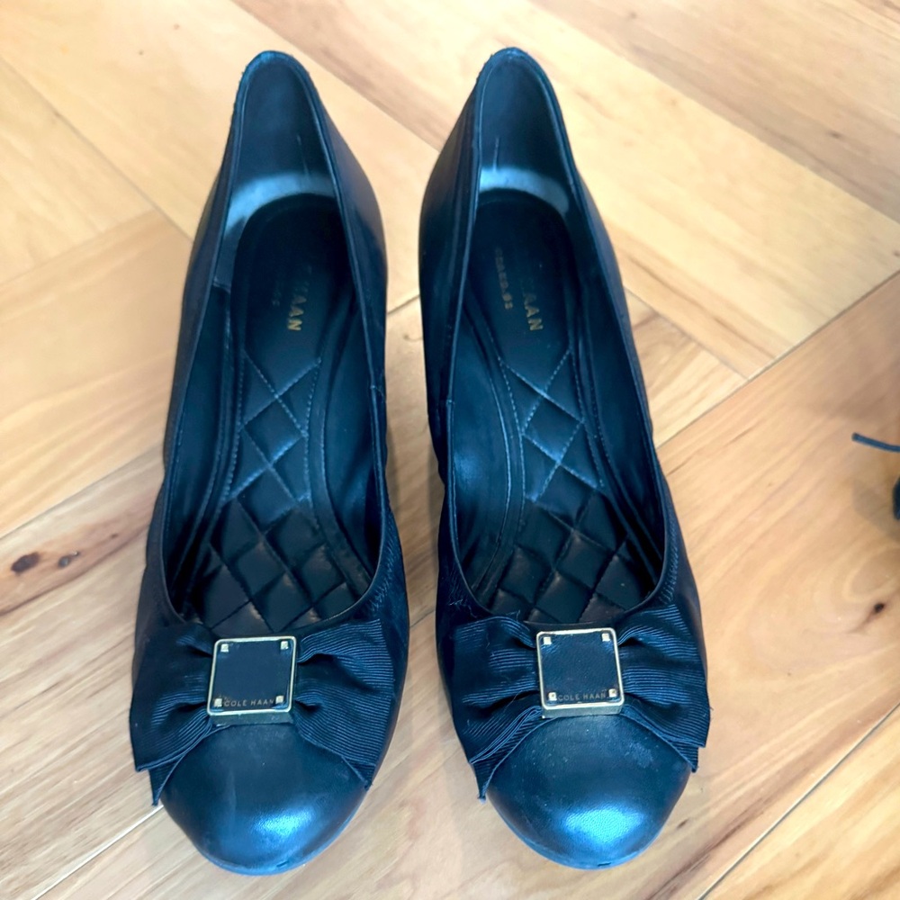 Cole Haan wedge black shoes with bow.